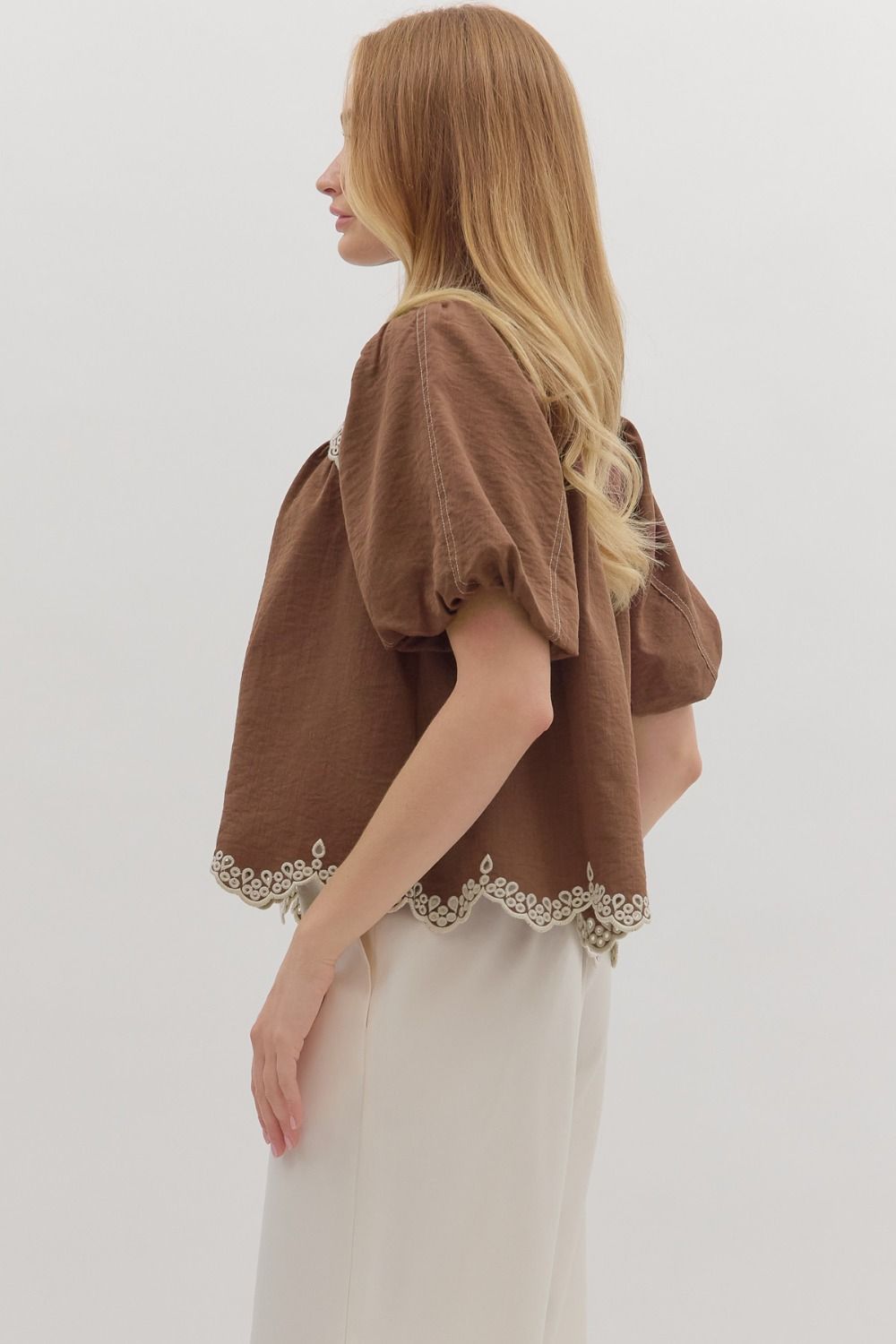 The Isolde top features romantic puff sleeves and scallop embroidered trim for a timeless, feminine finish.