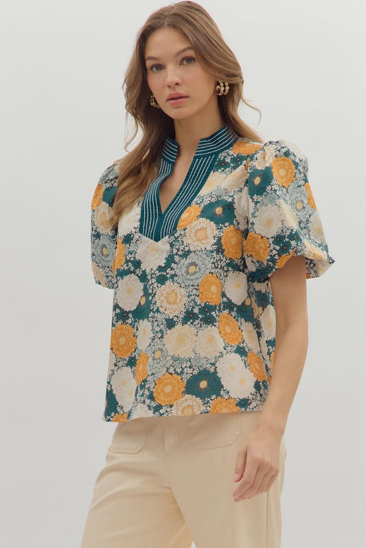 Chic and airy, the Seraphine top features bubble sleeves and a caftan-inspired neckline with contrast stitching.