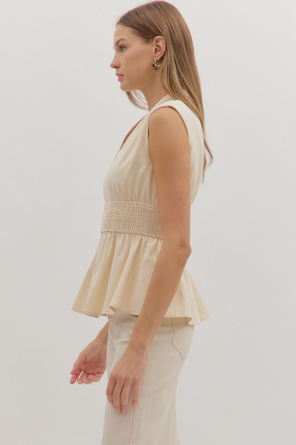 Chic and flattering, the Marceline top features a peplum silhouette with a wide smocked waist for a tailored finish.