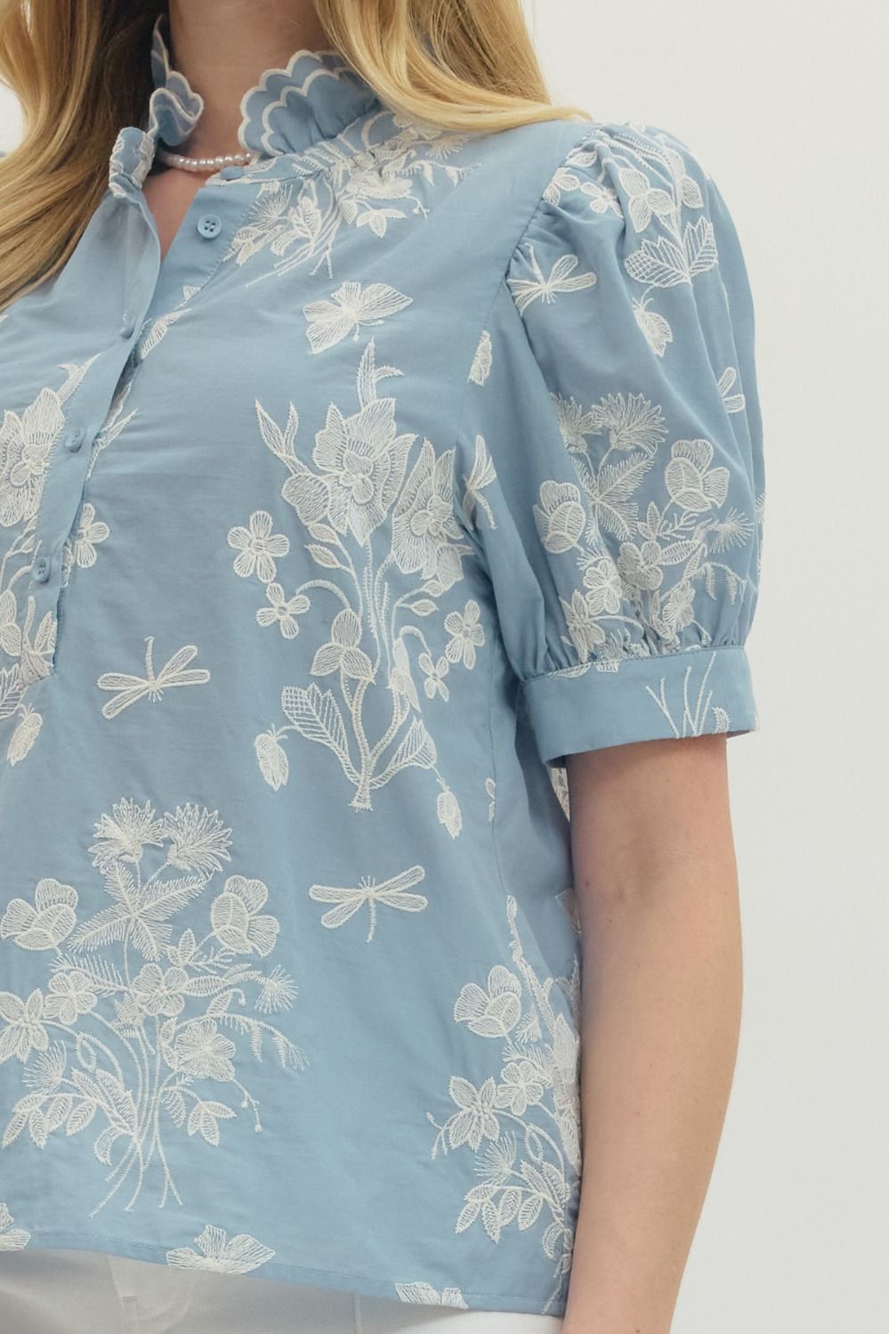 cotton top with embroidered detailing, scalloped mock neck, and short puff sleeves