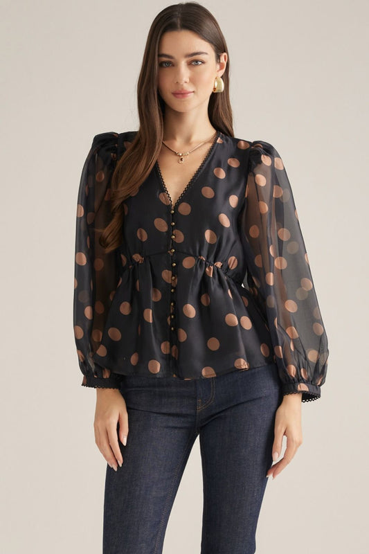 Women's polka dot woven top with V-neckline, long puff sleeves, decorative trim, button front, and elasticized back waist