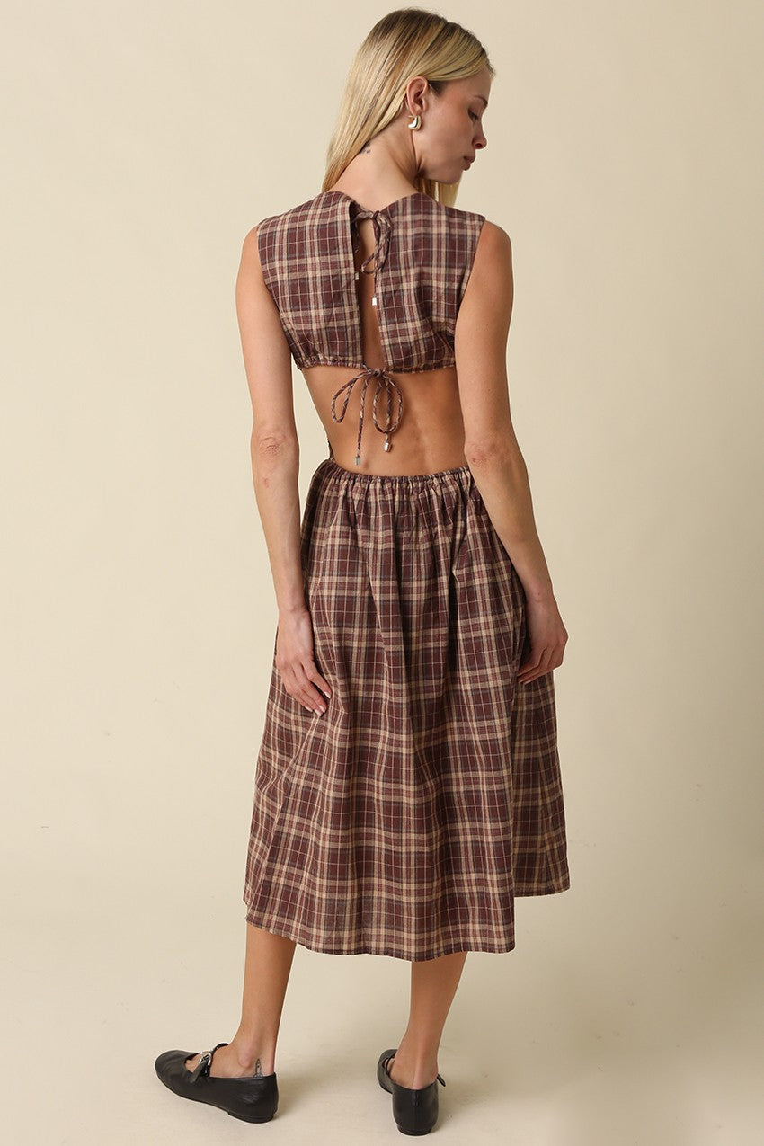 A romantic gingham maxi dress featuring an open-back tie detail, flattering fit-and-flare silhouette, and timeless plaid pattern for effortless feminine style.