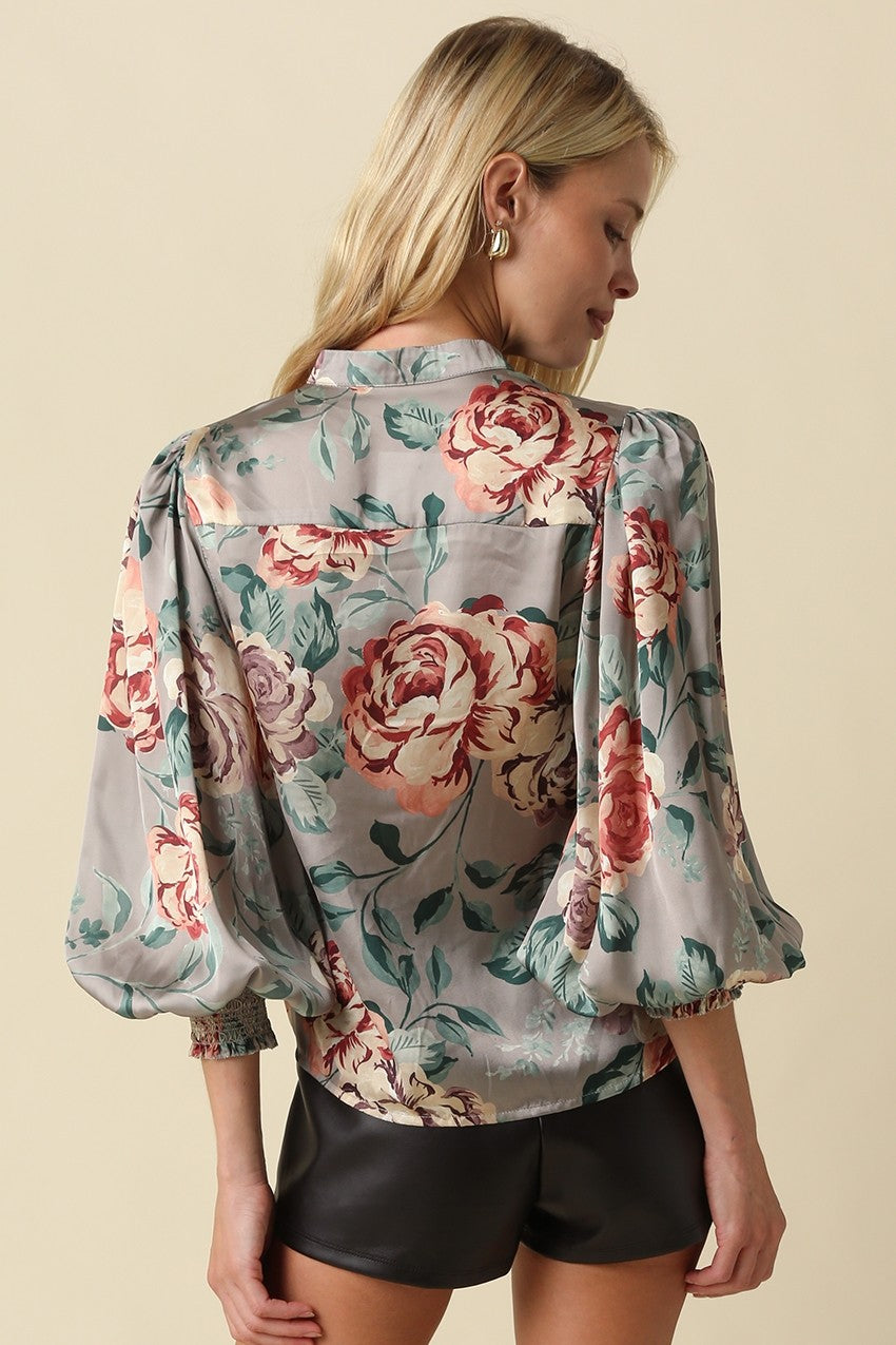 A romantic floral satin blouse featuring a classic collar, relaxed silhouette, and elegant ¾ balloon sleeves for effortlessly polished style.