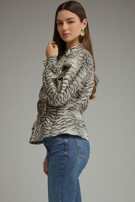Make a bold style statement with this animal print crossover top featuring voluminous puff sleeves, a flattering buckle waist, and a feminine V-neckline.