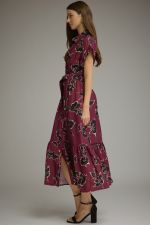 A feminine floral midi dress featuring a button-front bodice, adjustable self-tie waist, and flowing silhouette for timeless everyday elegance.
