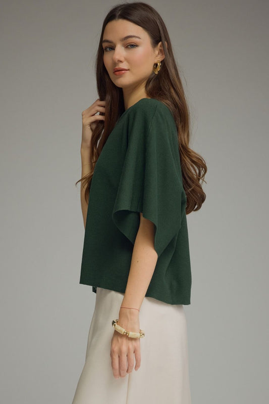 A versatile solid knit top featuring a classic round neckline and lightweight, non-sheer fabric for effortless everyday style.