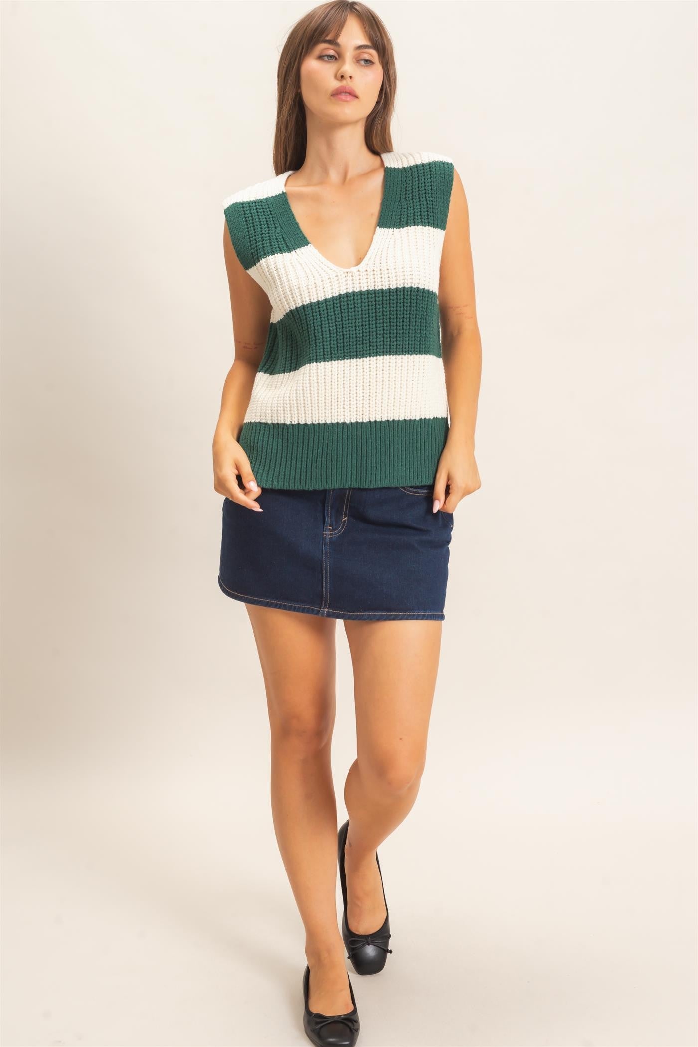 A bold striped sweater vest with a deep V-neckline and relaxed fit, perfect for polished layering from the office to after-hours.