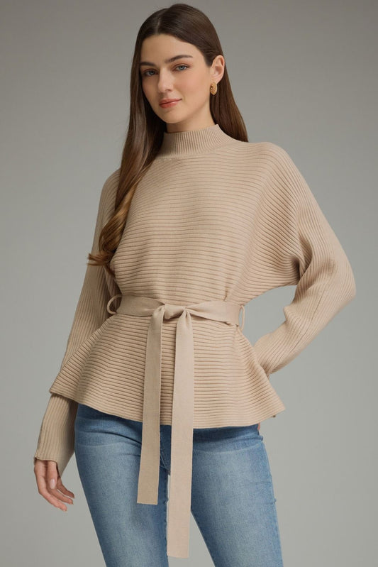 A polished ribbed peplum sweater with a flattering self-tie waist and mock neckline for an effortlessly feminine, put-together look.