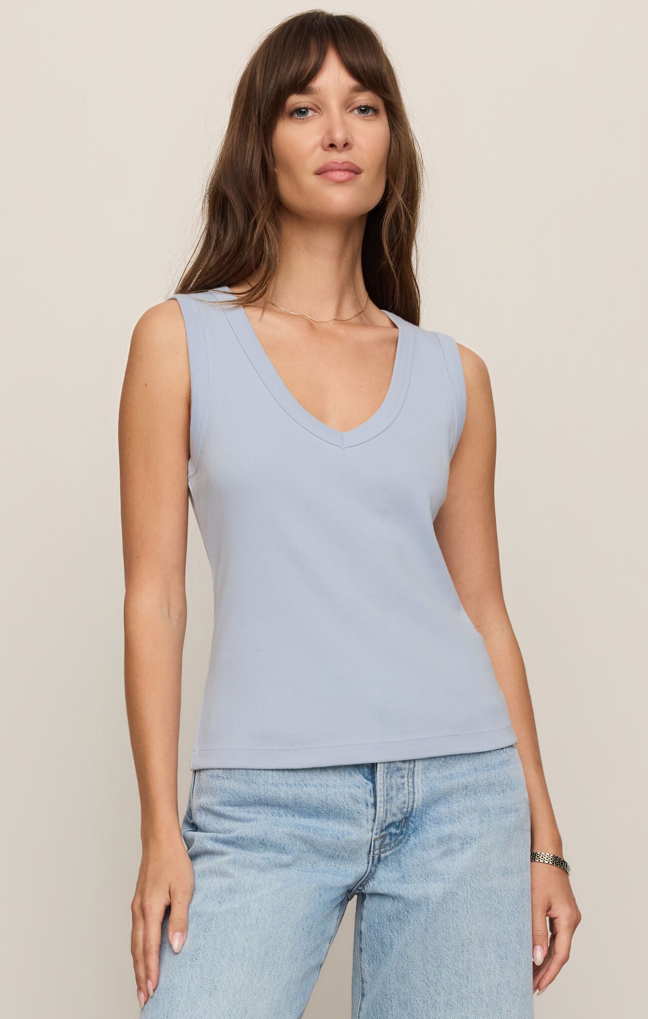 A soft and versatile everyday essential, this 100% cotton baby rib tank features a flattering V-neck, wide straps, and a comfortable bra-friendly fit.