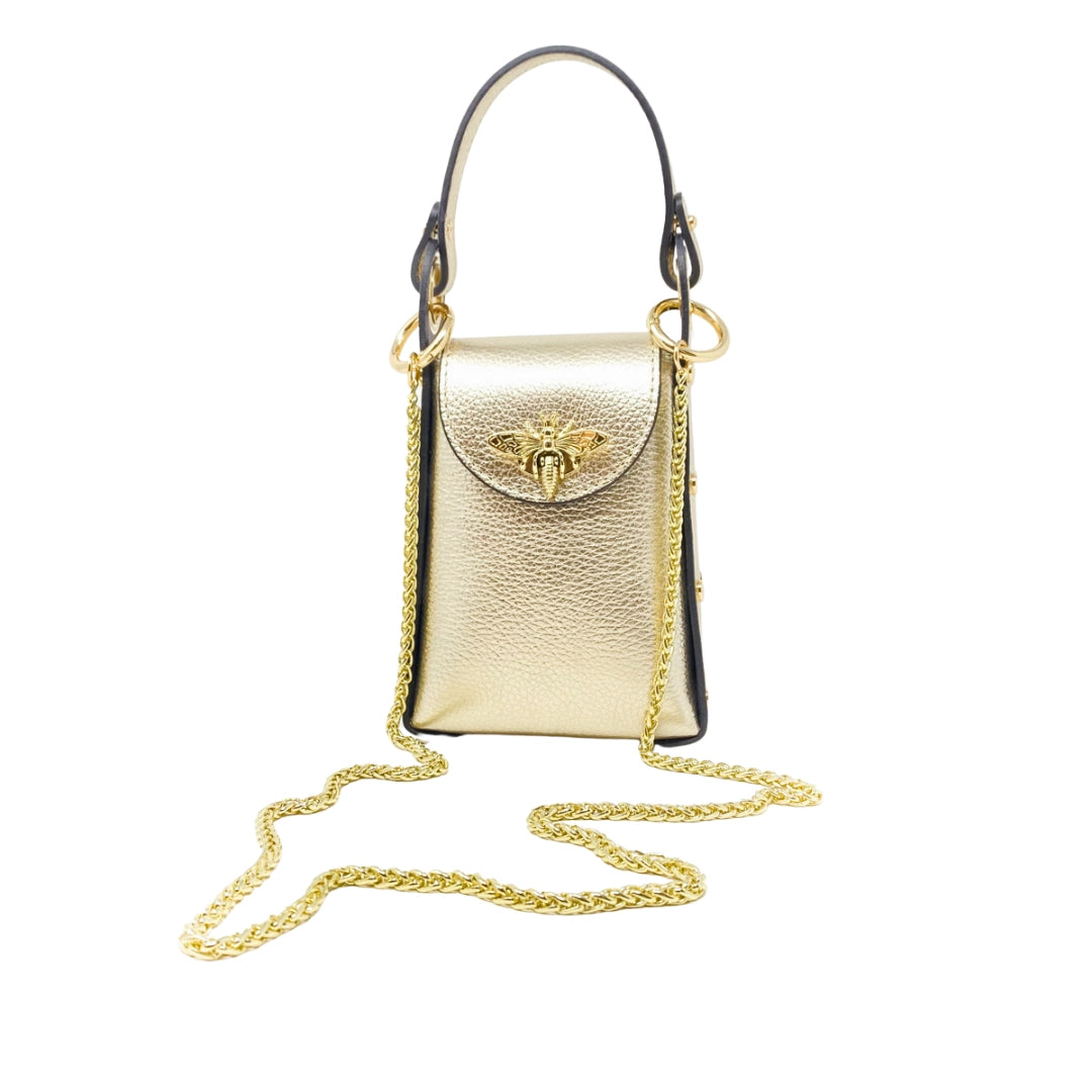 Gold handbag with a chain strap on a white background