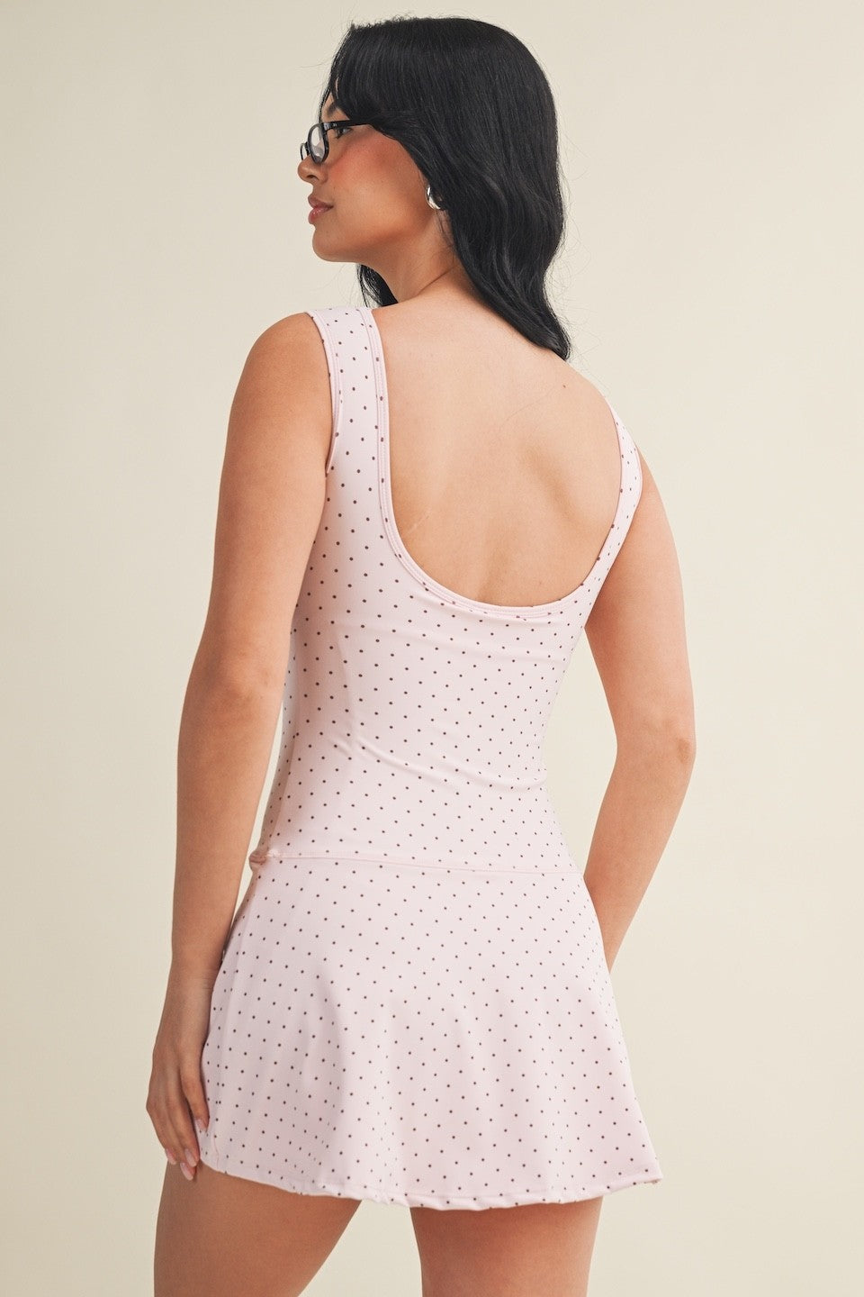 polka dot A-line mini dress with drop waist, soft stretch-knit fabric, and relaxed fit
