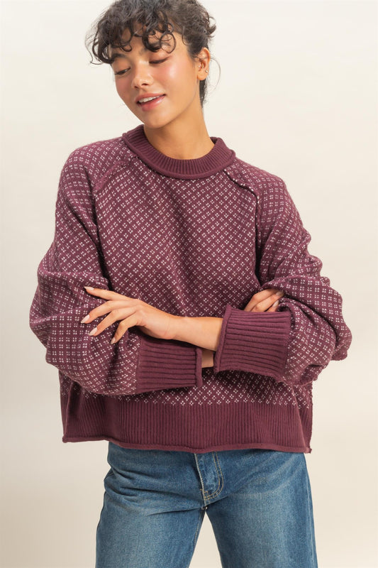 A cozy mock-neck sweater with a refined geometric pattern for effortless style.