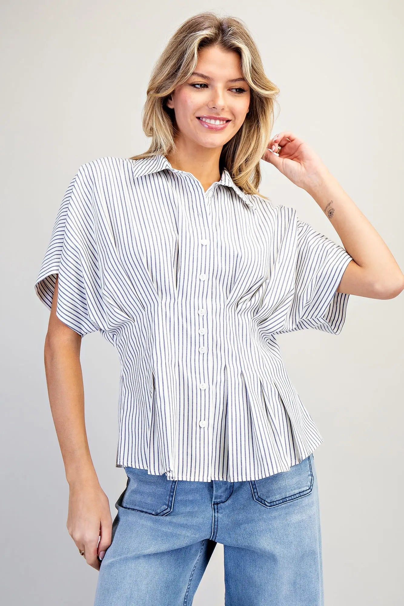 Striped pleated button down top with peplum hem