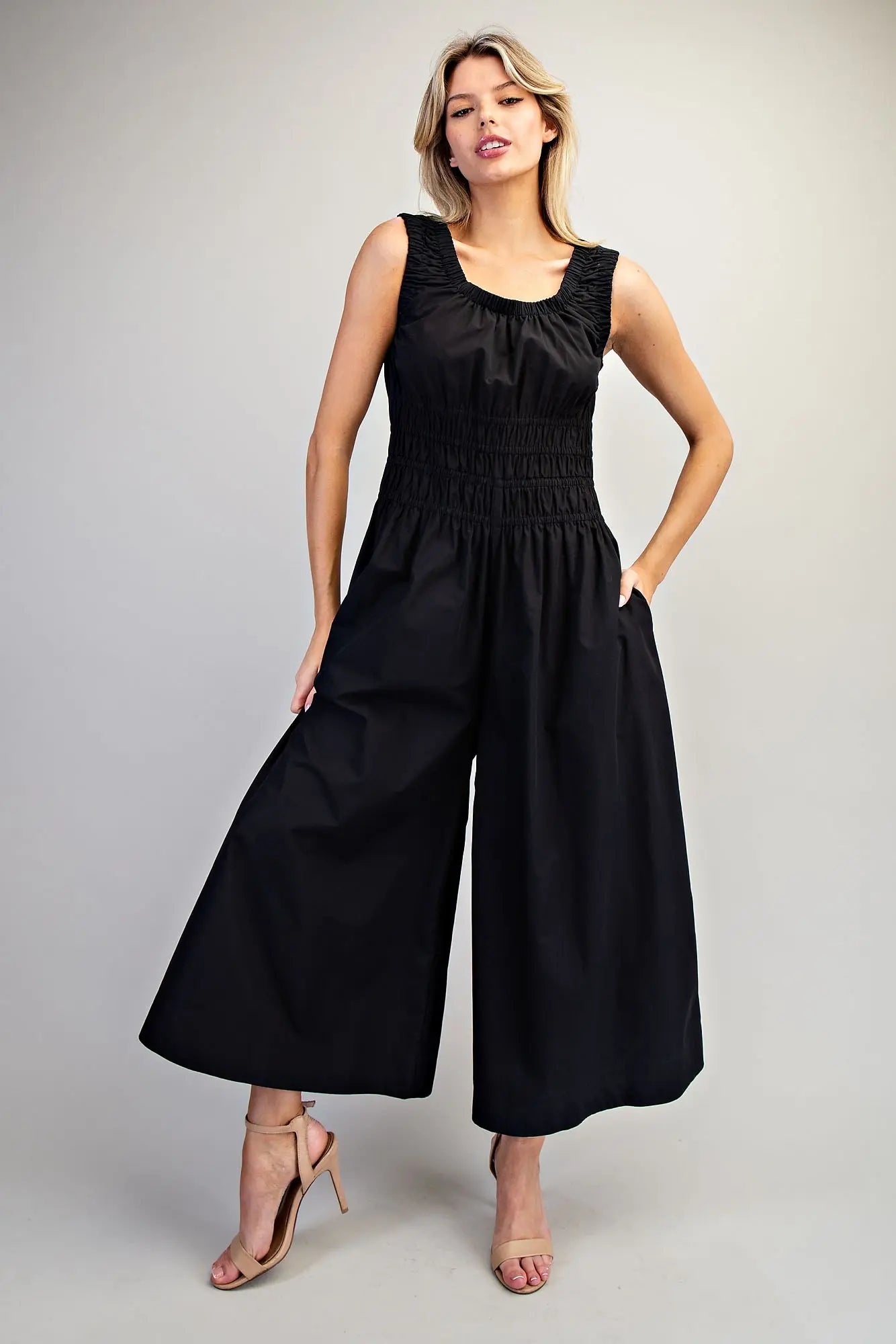 Sleeveless wide-leg jumpsuit with ruched waist and scoop neckline