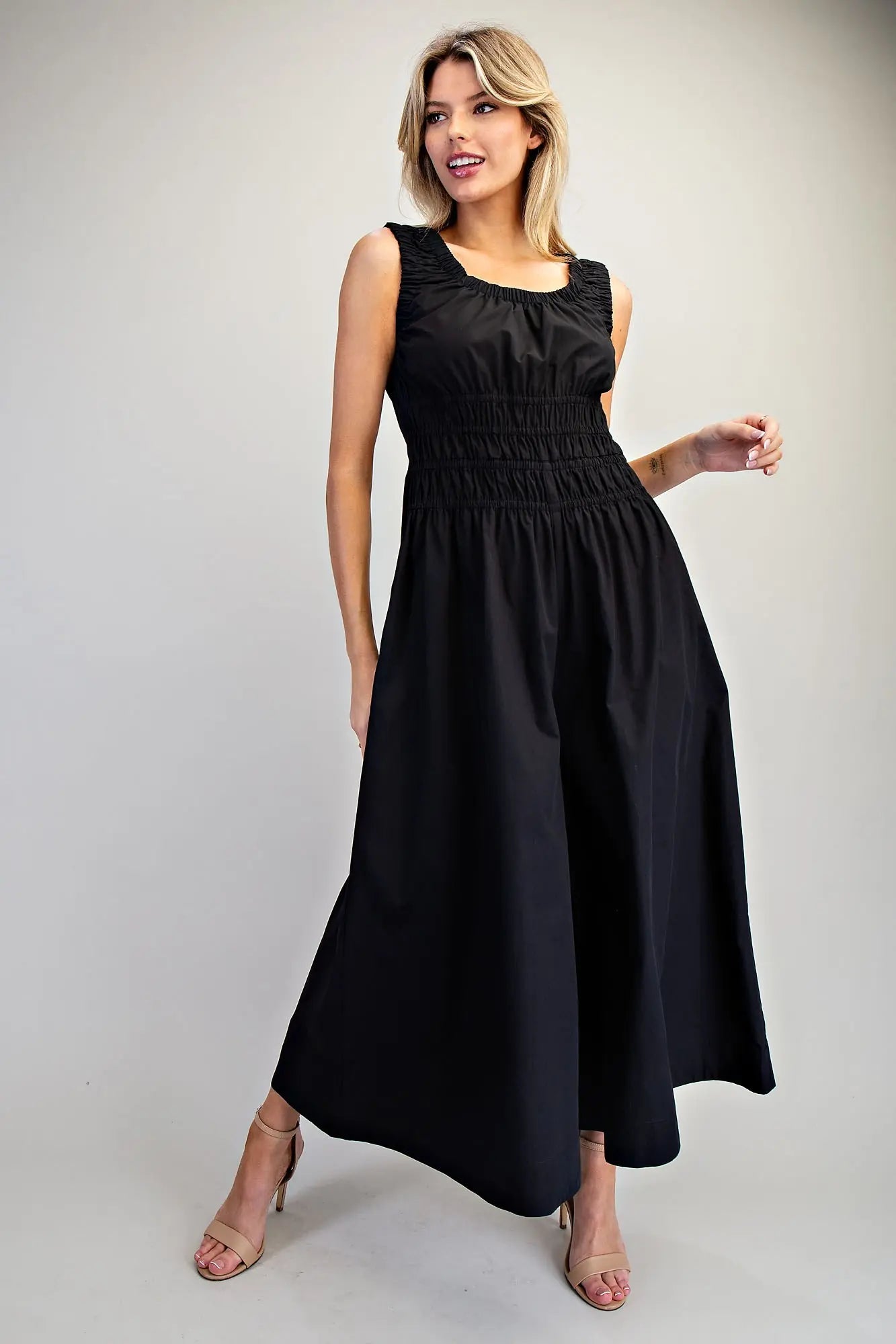 Sleeveless wide-leg jumpsuit with ruched waist and scoop neckline