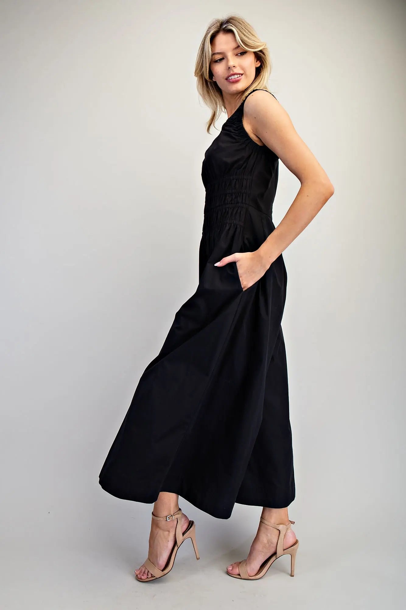 Sleeveless wide-leg jumpsuit with ruched waist and scoop neckline
