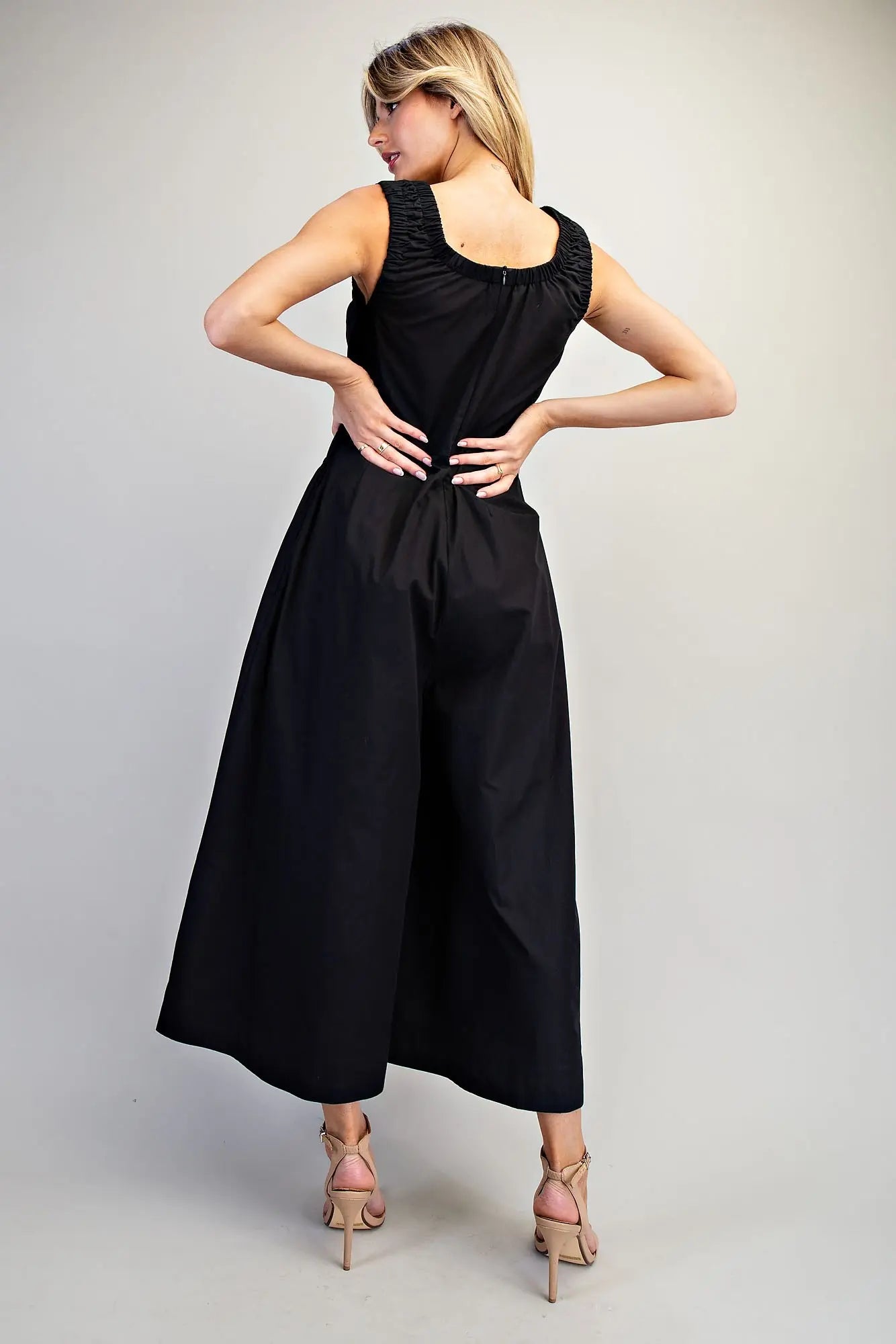 Sleeveless wide-leg jumpsuit with ruched waist and scoop neckline
