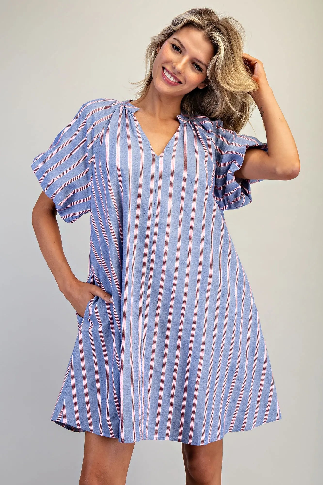 Striped mini dress with puff sleeves and gathered V-neckline