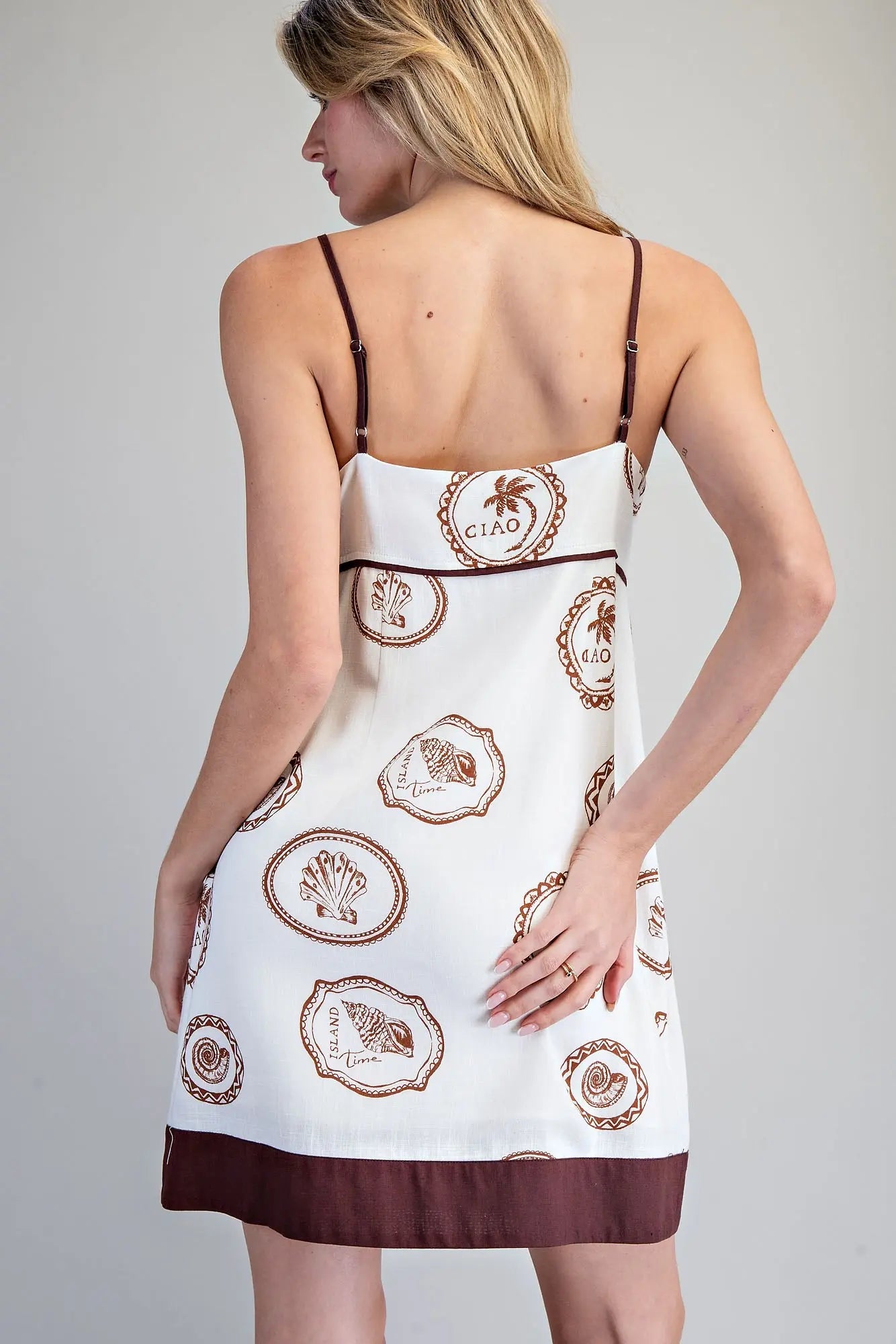 Mini Dress features a coastal-inspired print with adjustable shell straps and a breezy A-line silhouette