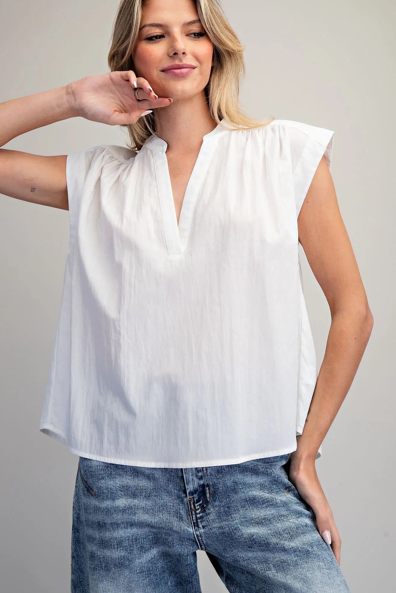 Split neck sleeveless blouse with pleated back detail