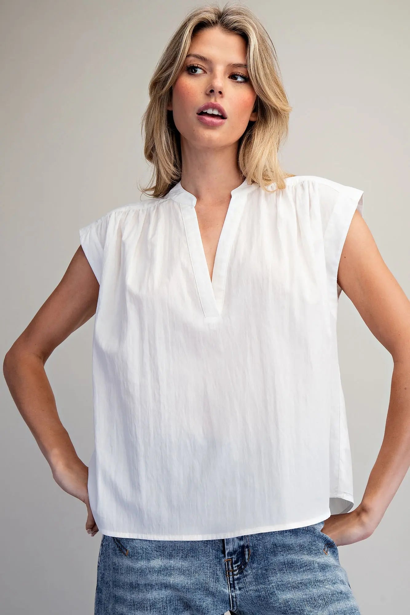 Split neck sleeveless blouse with pleated back detail
