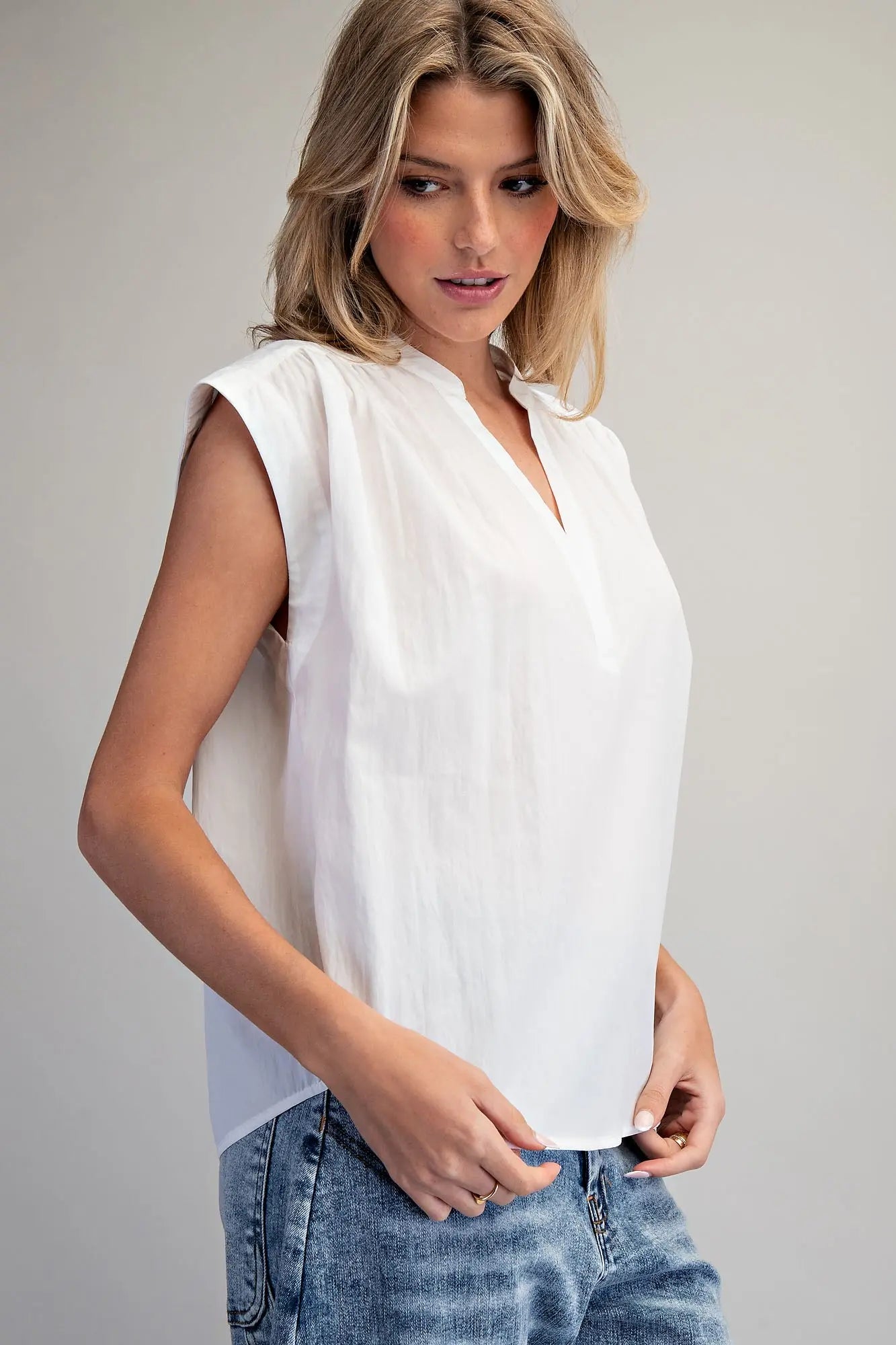 Split neck sleeveless blouse with pleated back detail
