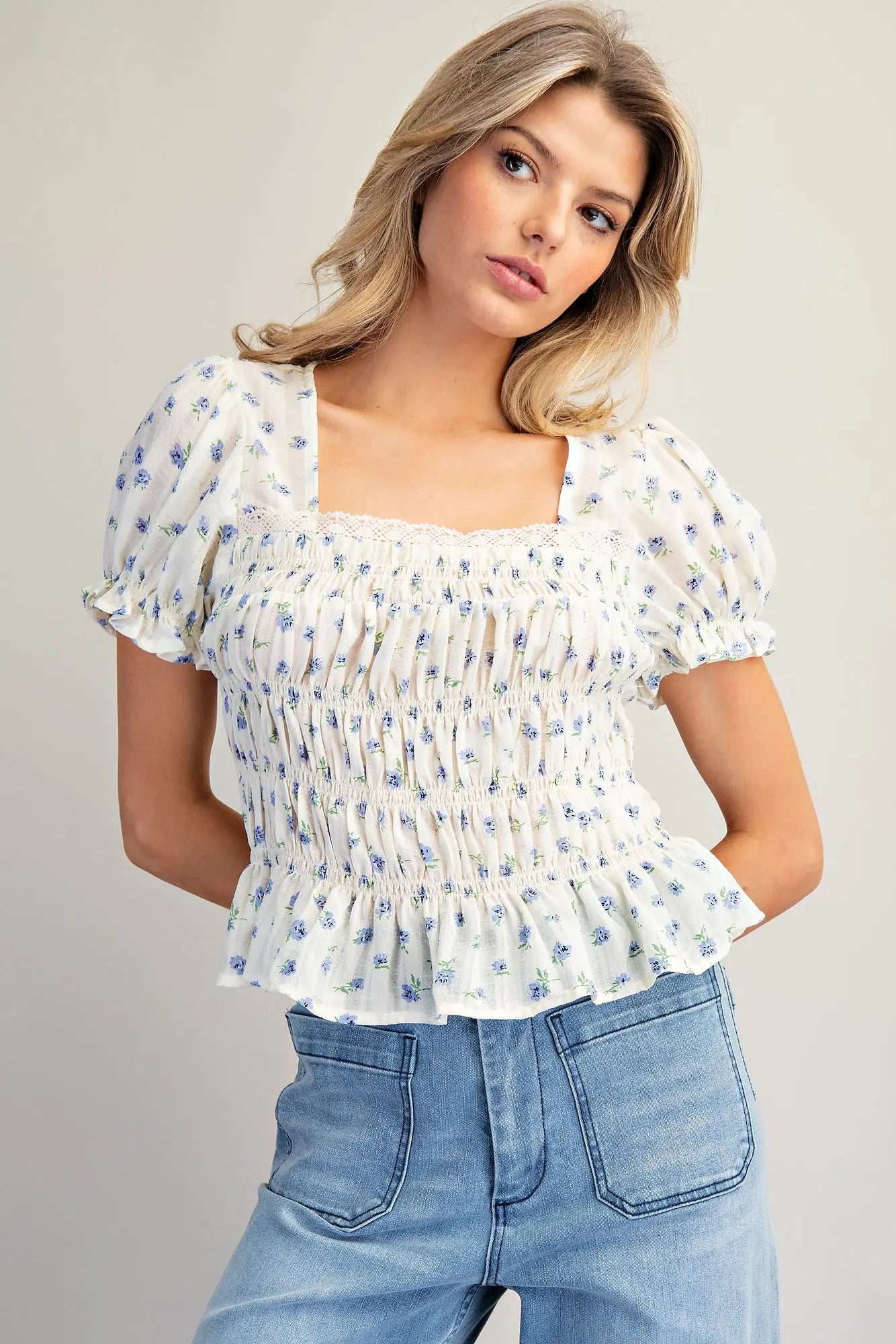 Floral print smocked peplum blouse