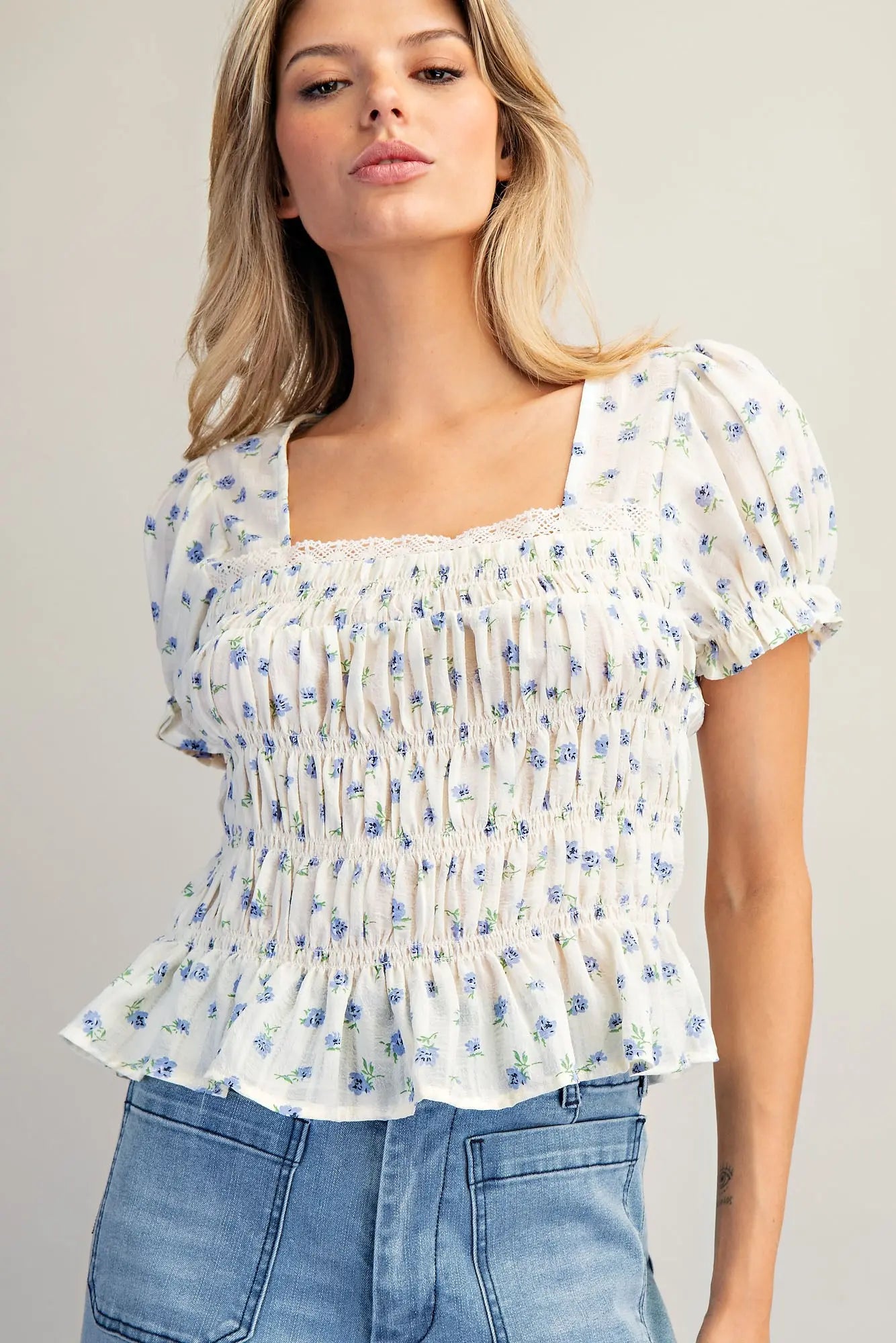 Floral print smocked peplum blouse