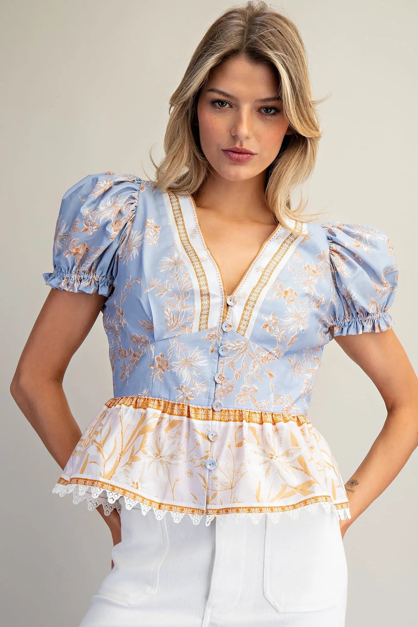 Floral contrast peplum hem blouse with puff sleeves and lace trim