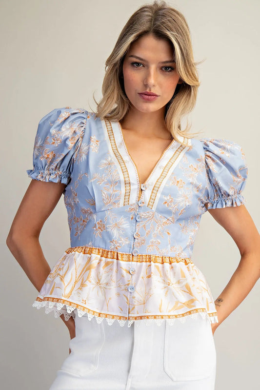 Floral contrast peplum hem blouse with puff sleeves and lace trim