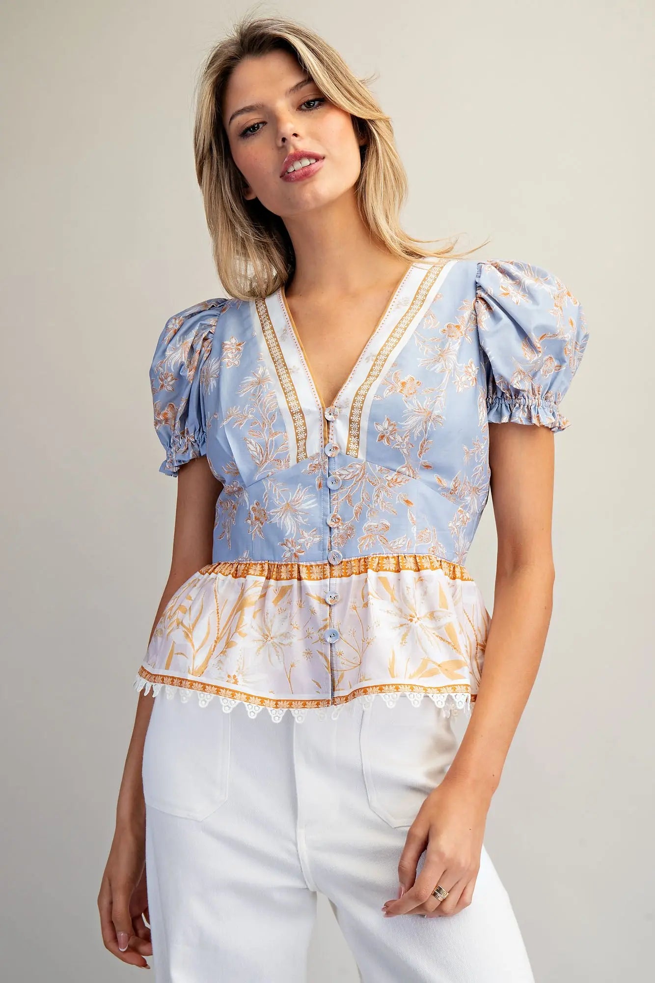 Floral contrast peplum hem blouse with puff sleeves and lace trim