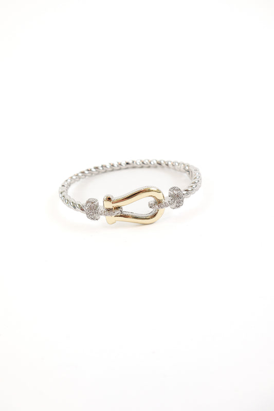 Two-tone silver twisted bracelet with gold hook clasp and pavé crystal accents