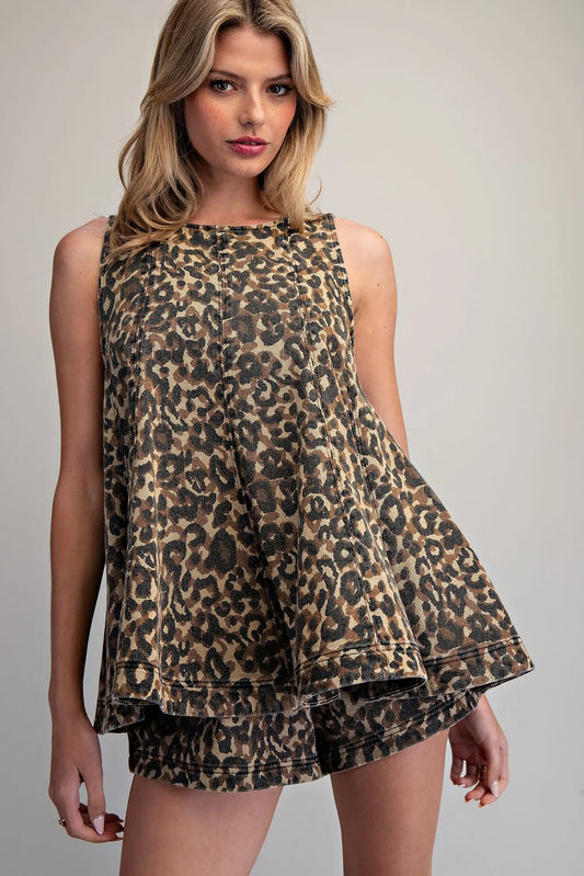 Leopard print sleeveless trapeze top with tiered hem and high crew neckline in cotton denim fabric.