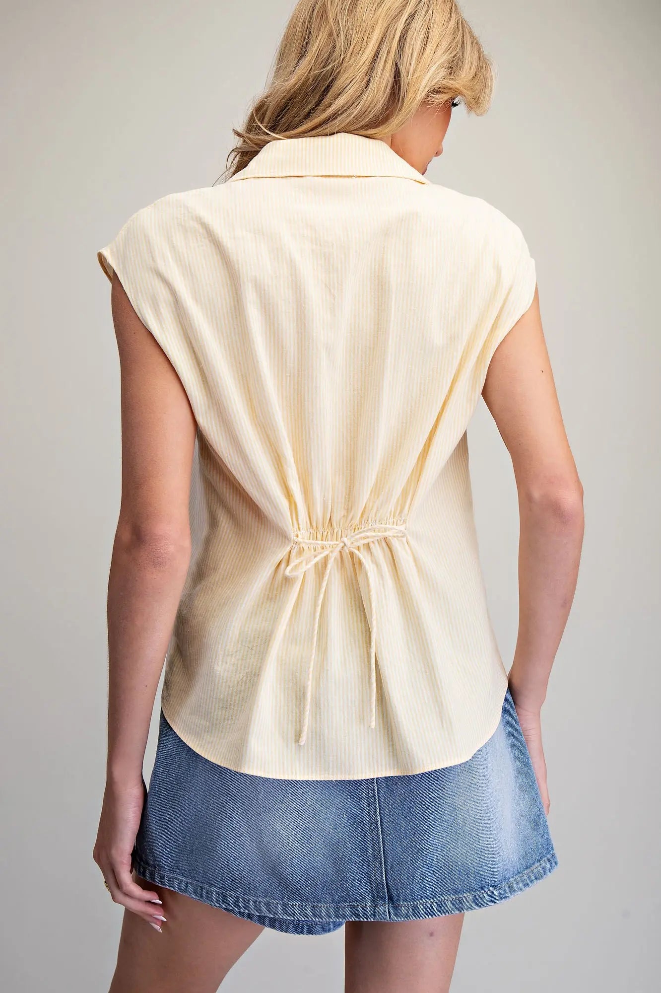 Striped button down blouse with cinch tie back