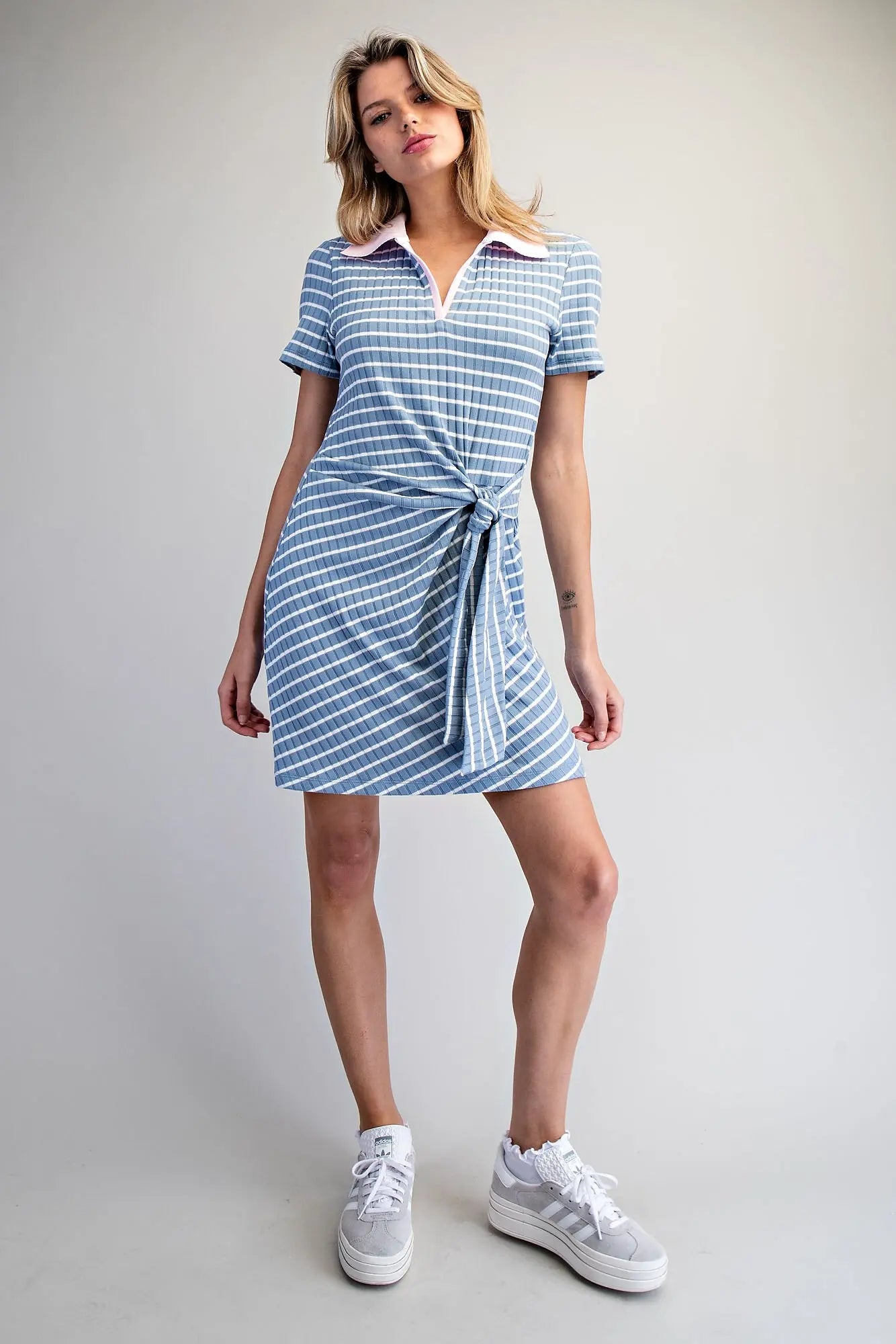 Stripe Waist Tie Mini Dress features a sporty polo collar, flattering wrap-style waist tie, and soft ribbed knit fabric