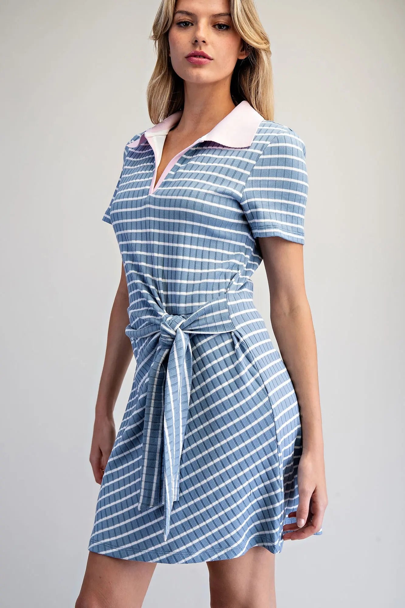 Stripe Waist Tie Mini Dress features a sporty polo collar, flattering wrap-style waist tie, and soft ribbed knit fabric