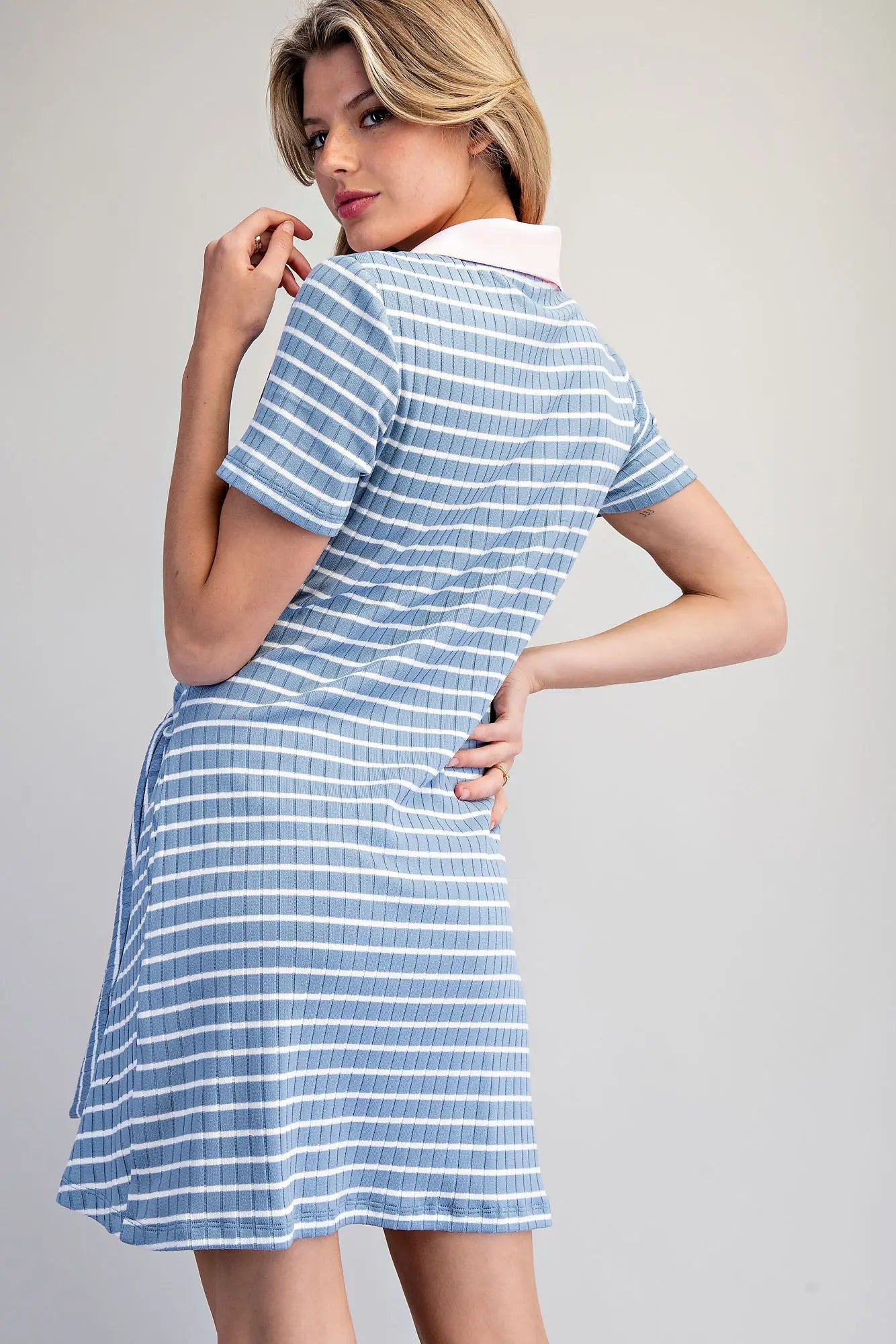 Stripe Waist Tie Mini Dress features a sporty polo collar, flattering wrap-style waist tie, and soft ribbed knit fabric