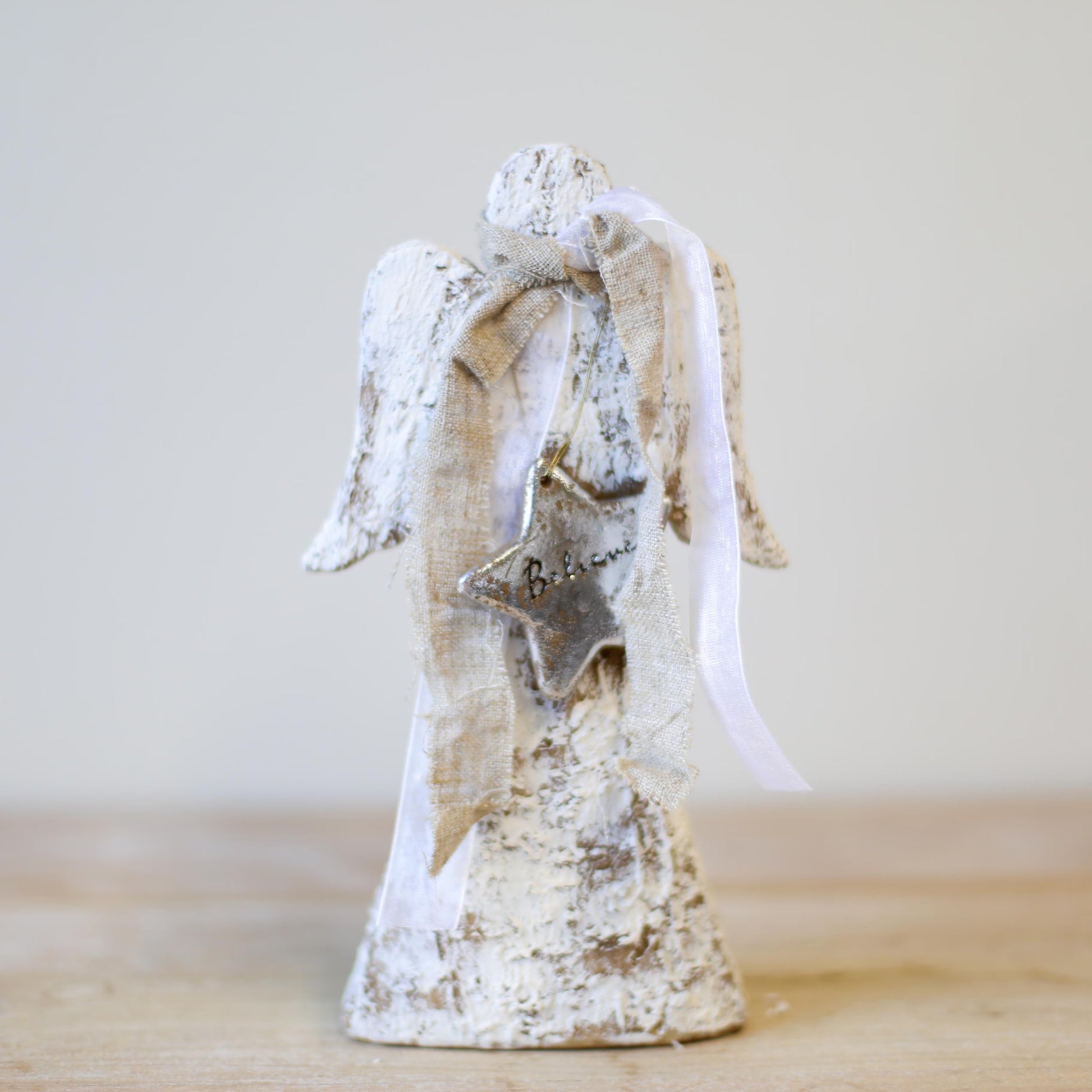 An angel with a white wash finish. 9.5"