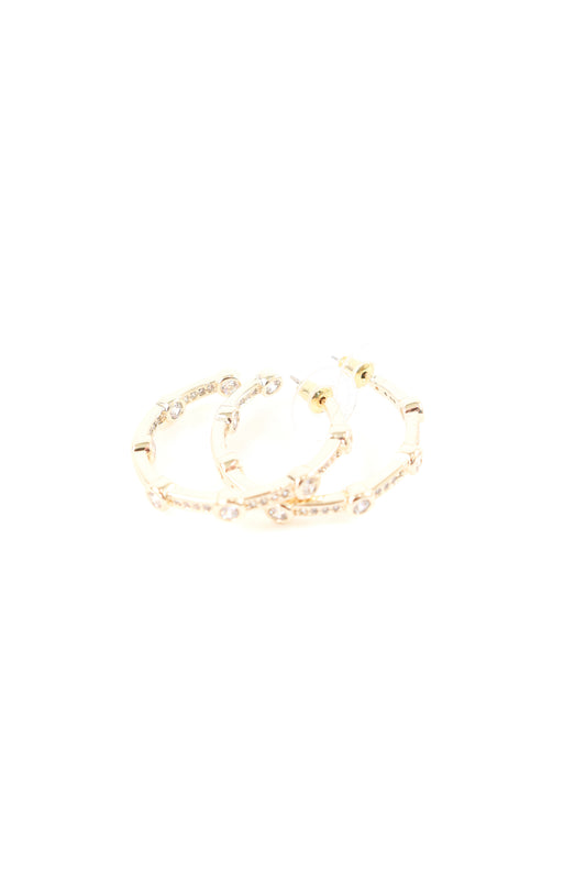 Gold hoop earrings with pavé crystal and bezel-set stone detailing, women’s boutique statement jewelry.