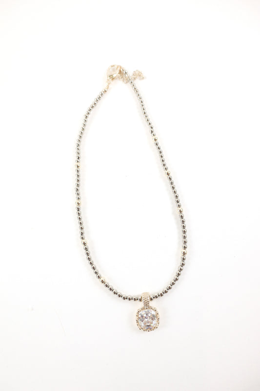 Silver beaded necklace with cushion-cut crystal pendant and pavé detailing, women’s boutique statement jewelry.