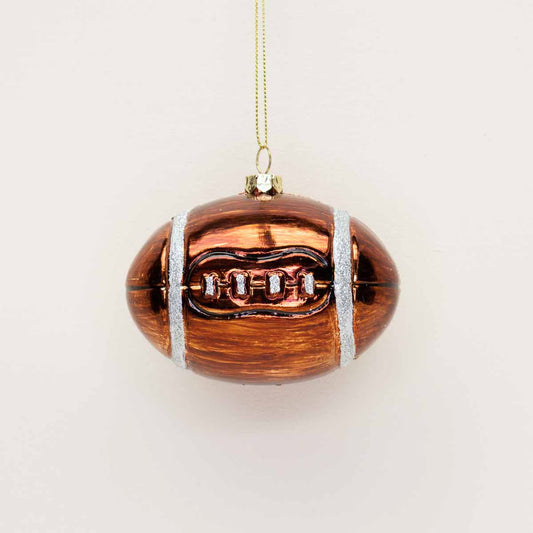 Festive football ornament. Perfect for hanging anywhere, it brings a fun, spirited vibe that’s sure to make you smile every time you see it