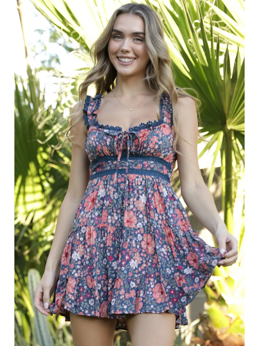 Sleeveless floral print mini dress with scoop neck and lace trim
