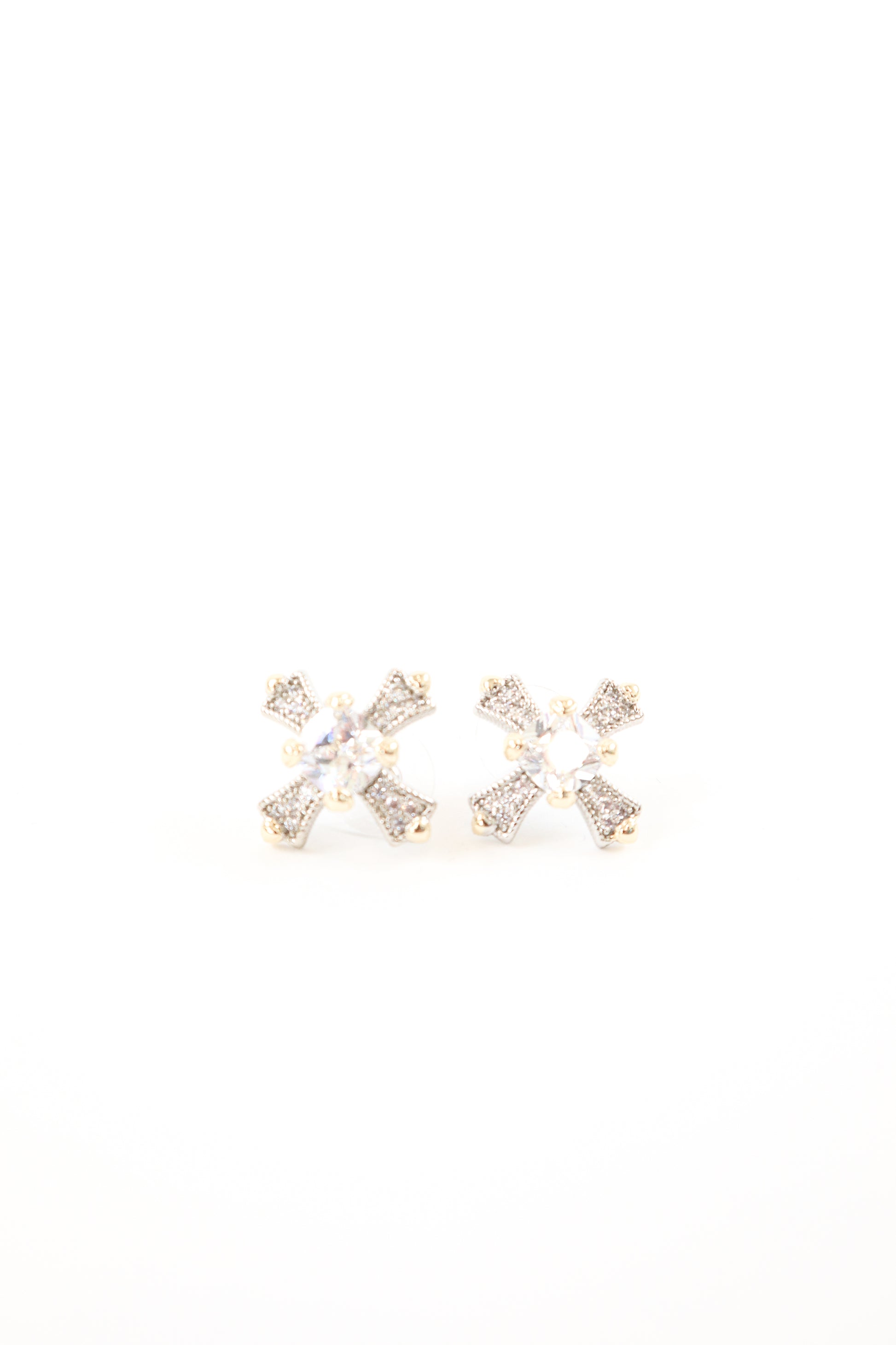 Gold and silver pavé cross stud earrings with round crystal center stone, women’s boutique statement jewelry.
