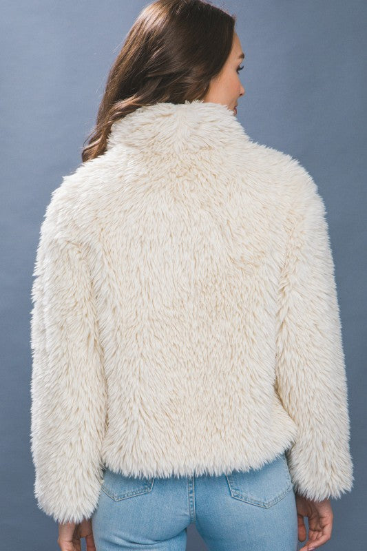 The Sabina Mid Waist Faux Fur Coat brings luxe texture and timeless warmth to your cold-weather wardrobe.