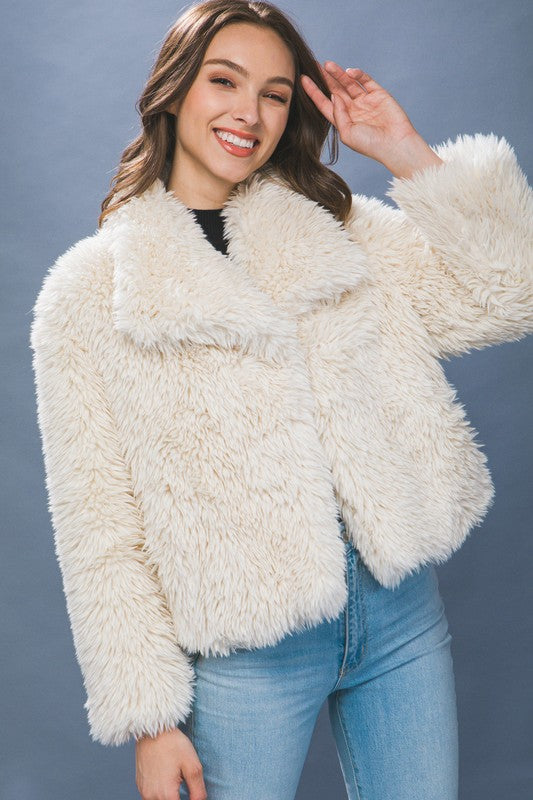 The Sabina Mid Waist Faux Fur Coat brings luxe texture and timeless warmth to your cold-weather wardrobe.