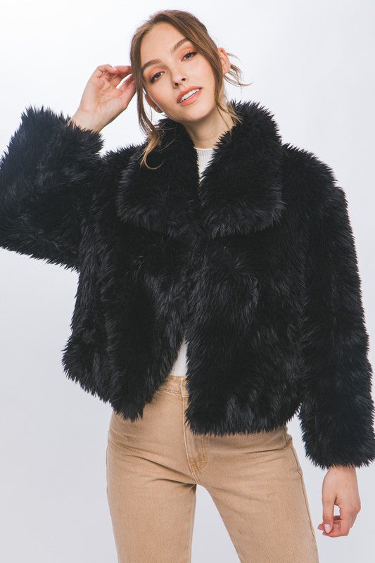 The Sabina Mid Waist Faux Fur Coat brings luxe texture and timeless warmth to your cold-weather wardrobe.