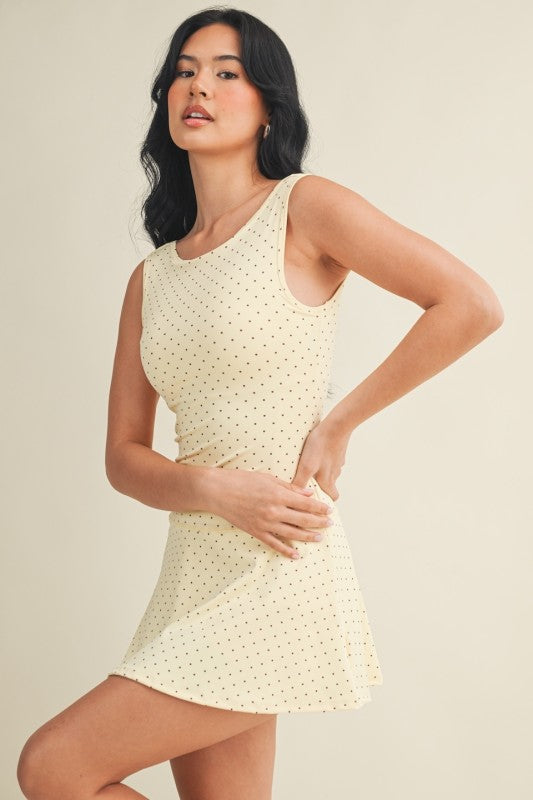 polka dot A-line mini dress with drop waist, soft stretch-knit fabric, and relaxed fit