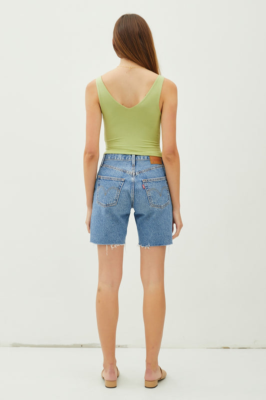 Cropped double V-neck sleeveless tank with scoop V back and stretchy rayon-spandex fabric.