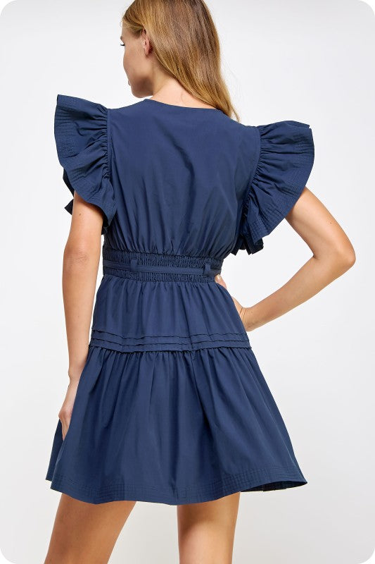 feminine cotton poplin mini dress with flutter sleeves, a babydoll silhouette, and a flattering cinched waist.