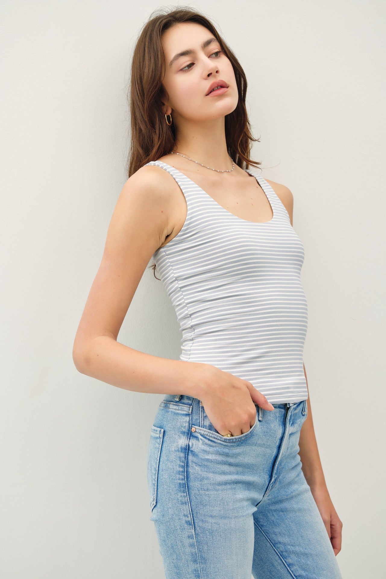 An ultra-soft, double-lined striped tank featuring a flattering scoop neck and back—your new go-to basic for layering or warm-weather styling.